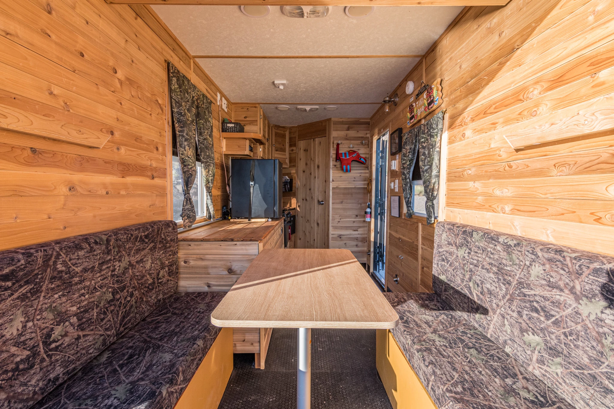 The Heidi-Ho's living/dining area includes seating and a table