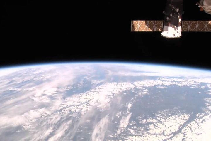 Visible in the top right is a Soyuz spacecraft, ready to ferry three ISS crewmen back to Earth (Photo: NASA)