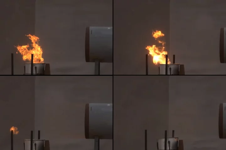 A flame is blown off its fuel source with a blast of air from explosives