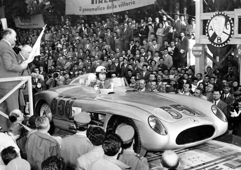 Fangio and the fabled Mercedes 300 SLR about to tackle the Mille Miglia.