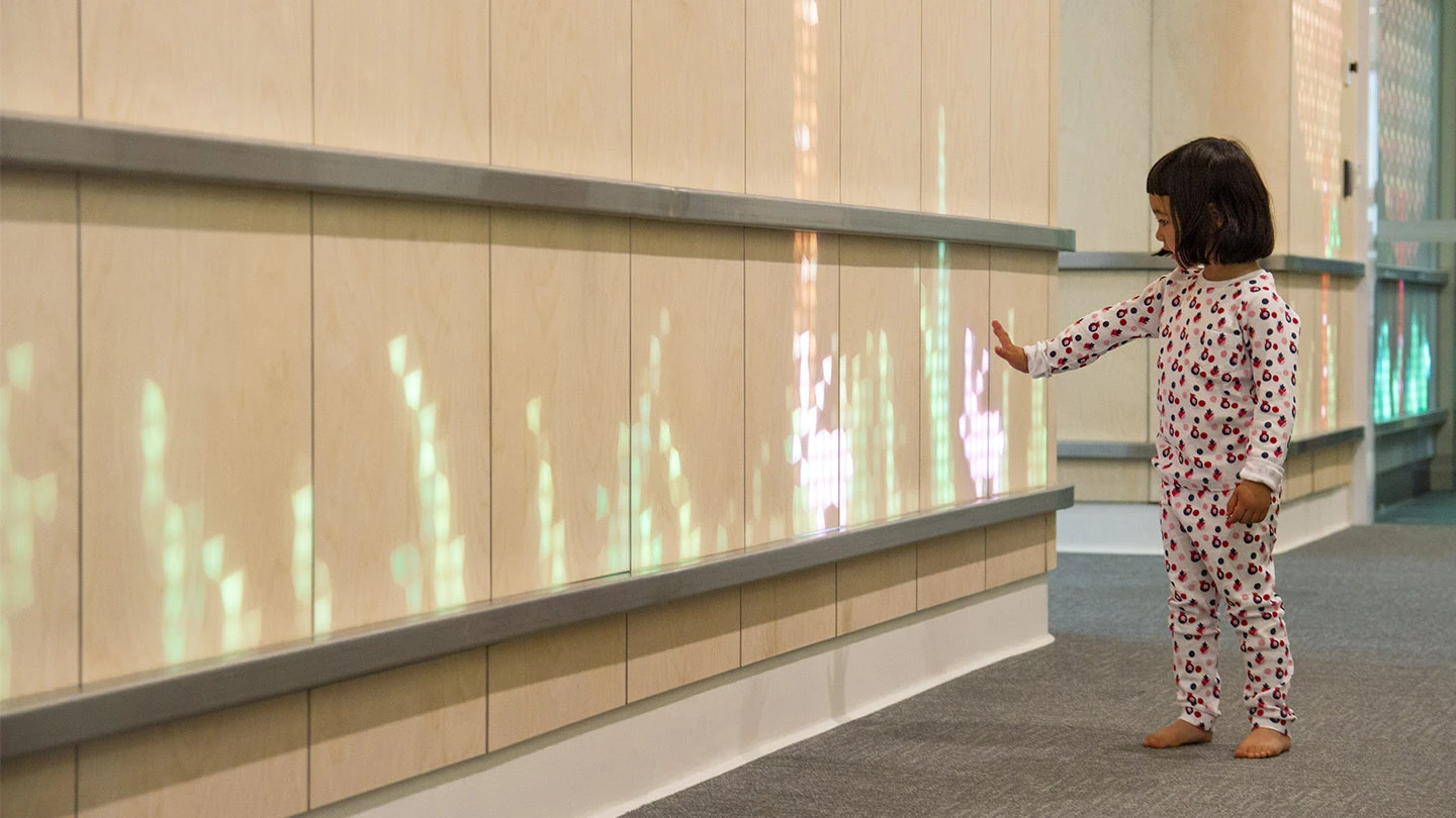 The hospital installation pictured consisted of 12 wood veneer-covered LED panels and three acrylic panels