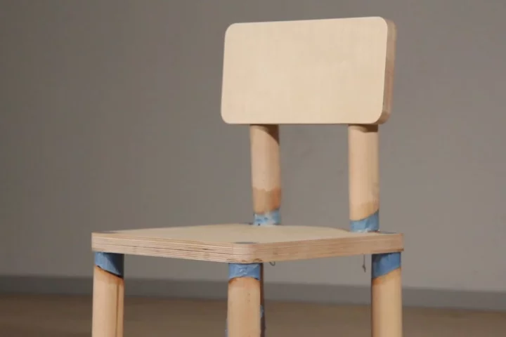 The "DRM Chair" is rigged with a counter that triggers it to fall to pieces after being sat on eight times
