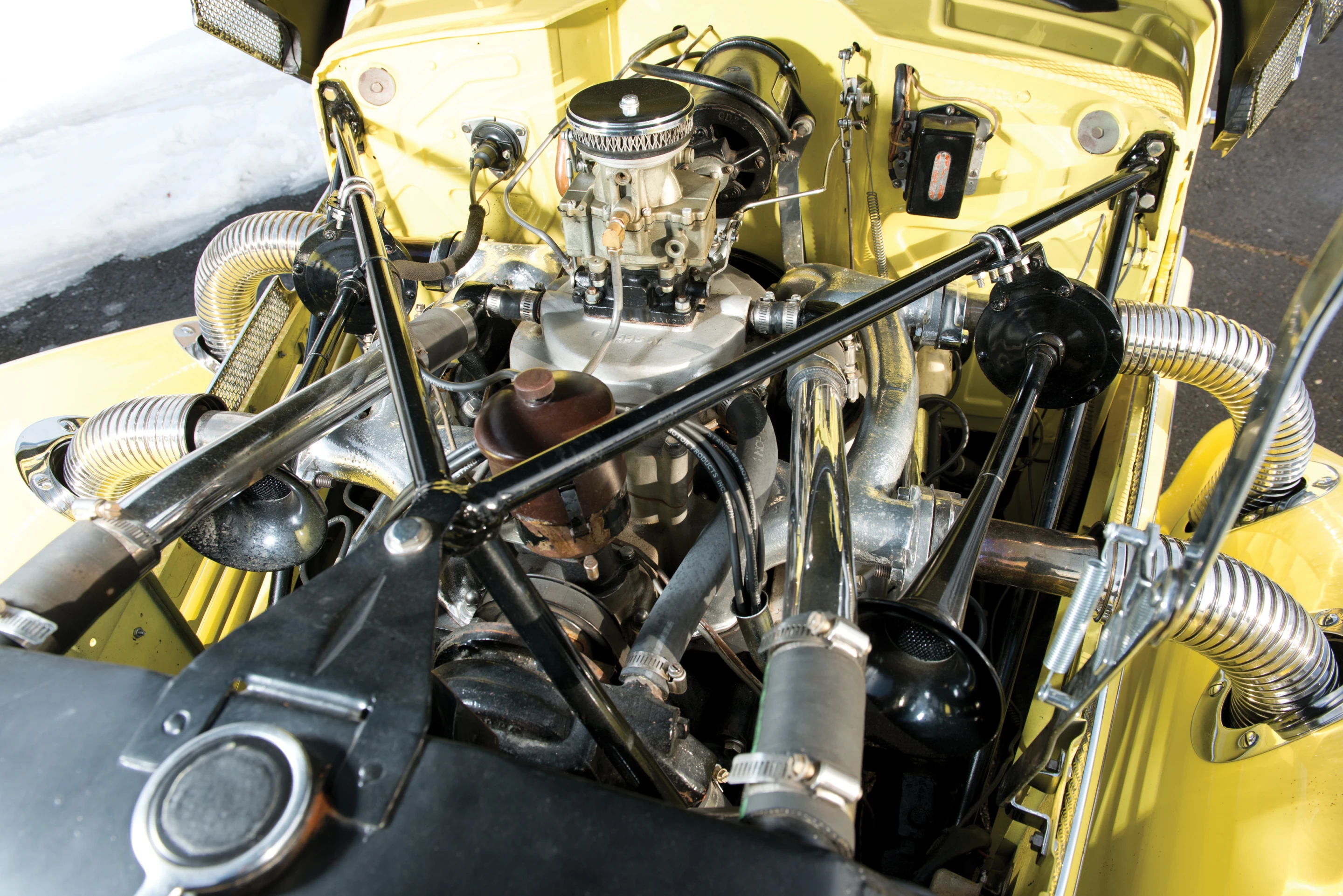 The Cord runs on a 190 bhp, 288 cu. in. supercharged L-head V-8 and a four-speed pre-selector manual transmission