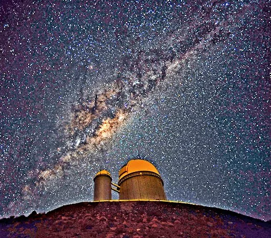 The ESO 3.6 meter (11.8 ft) telescope at La Silla, Chile, resting under the Milky Way's galactic center (Photo: ESO)