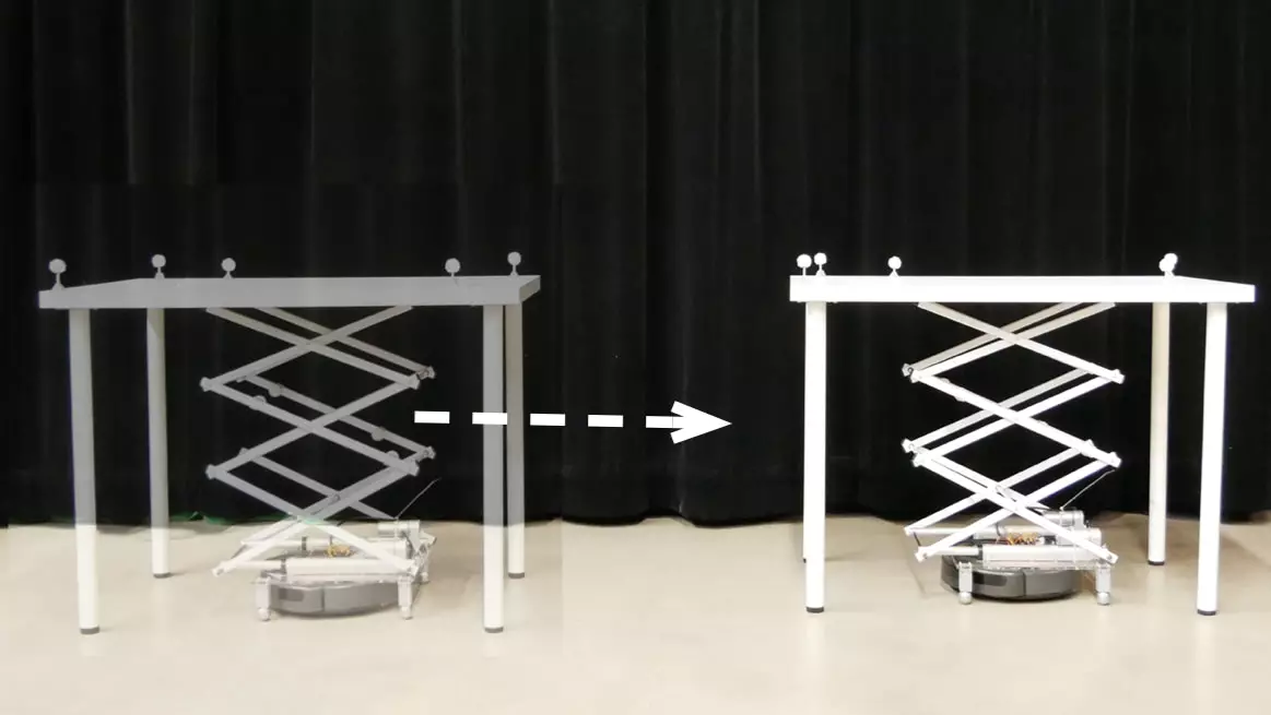 The RoomShift system works by having modified Roombas with scissor lifts attached to them pick up and move furniture around