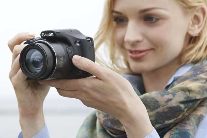 Canon has added two new super-zoom bridge cameras to its PowerShot line-up, the SX520 HS and SX400 IS
