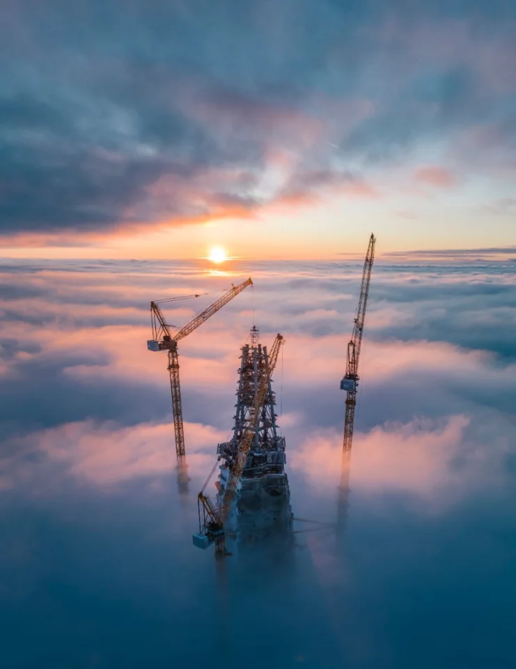 Sun rises over a skyscraper under construction in Saint Petersburg, Russia