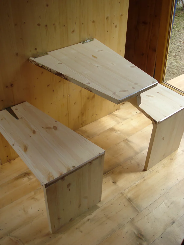 HomeBox includes many wooden inbuilt features such as the kitchen table and chairs