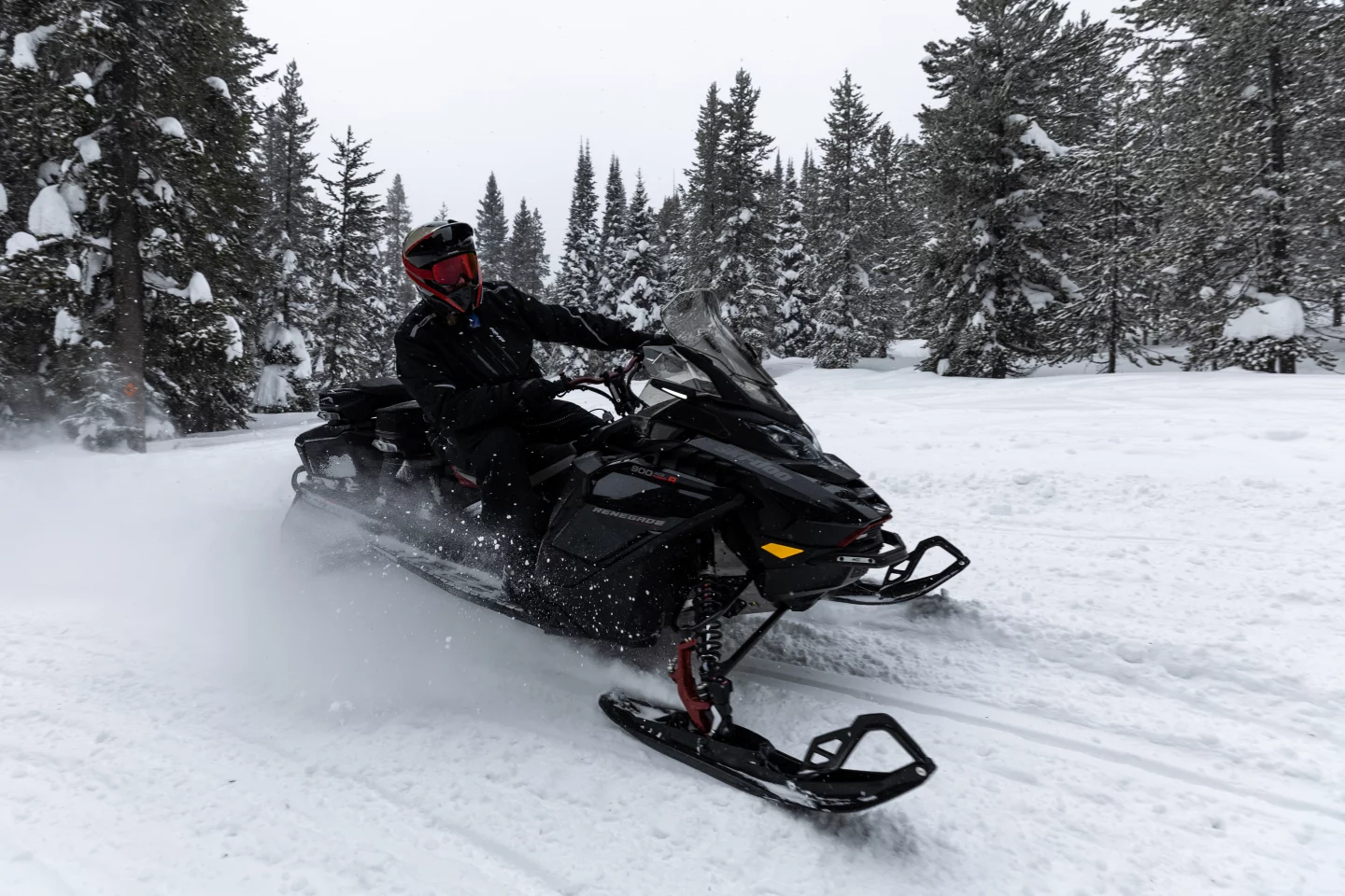 The author takes a corner outside of Yellowstone National Park on a Ski-doo Grand Touring model