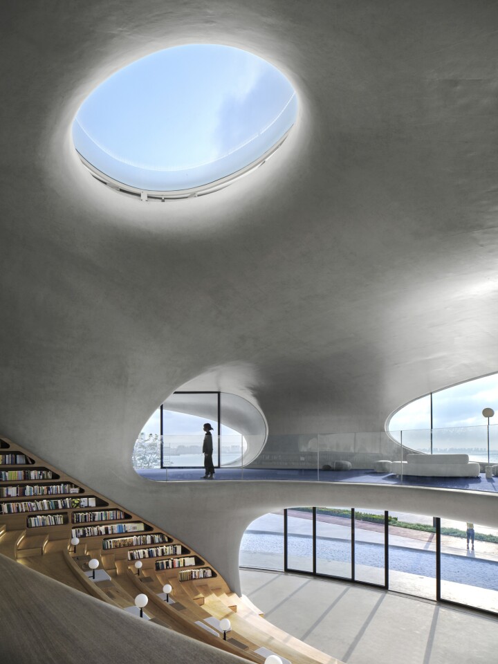 Cloudscape of Haikou's interior is naturally illuminated by strategically placed holes in the facade and ceiling