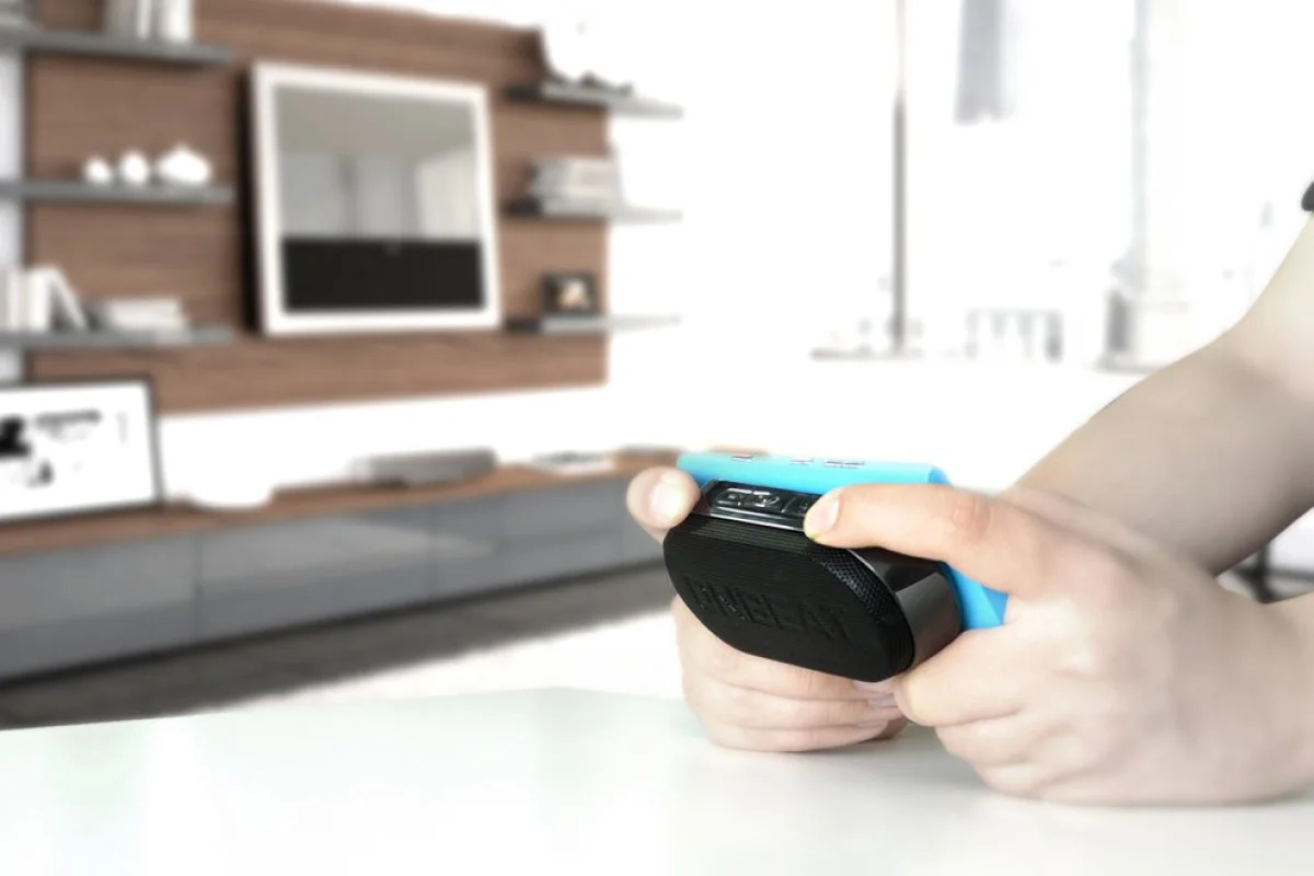 China's Divoom has unveiled a portable Bluetooth gaming speaker that sticks to the underside of a smartphone and vibrates in response to explosive onscreen action