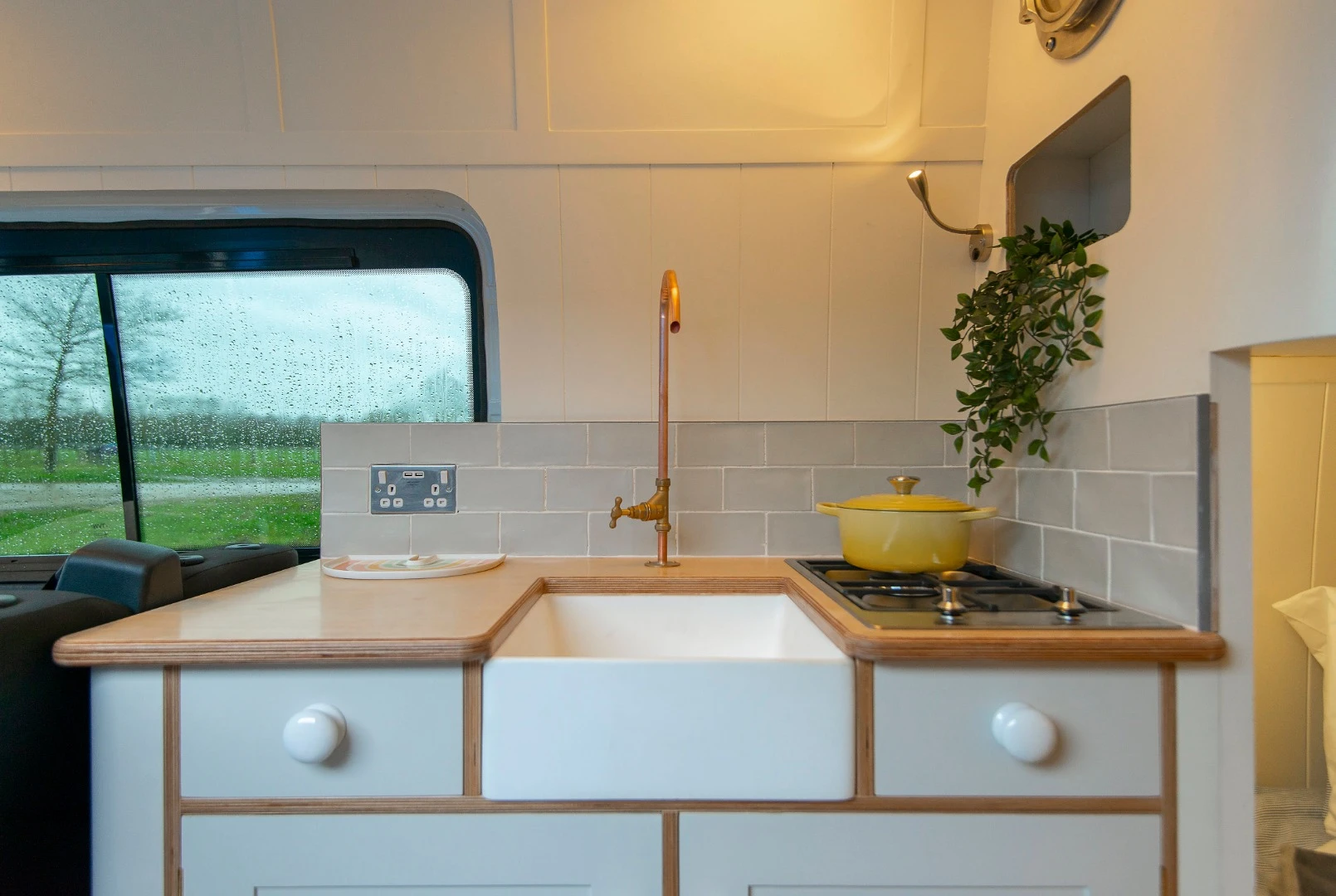 View out the window from the kitchen is a classic tiny house touch