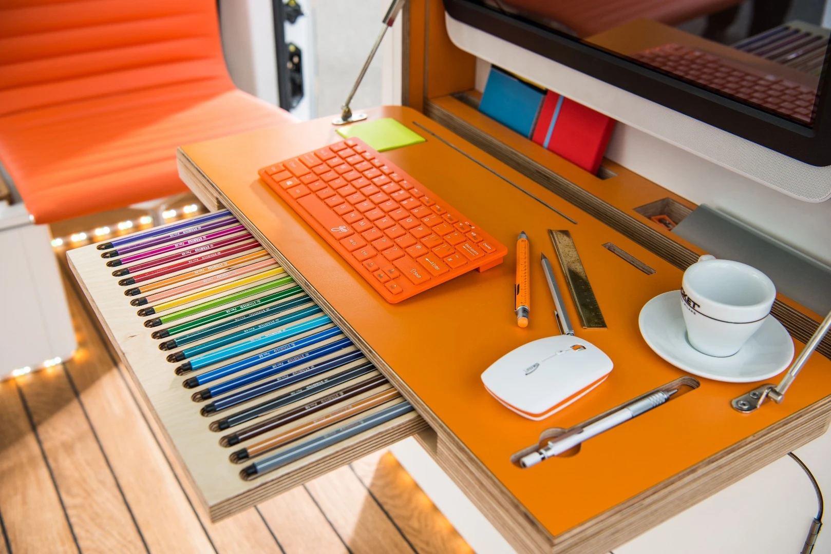 The desk includes neat organization to keep supplies from blowing all over the cabin during driving