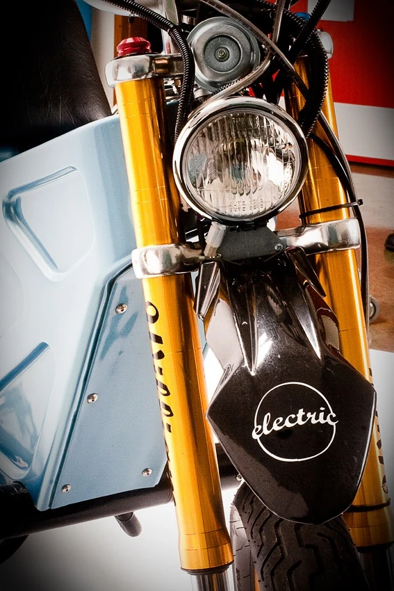 The prototype electric Deliver E-Trike has independently-pivoting rear swing arms, which allow it to stand upright when parked on grades