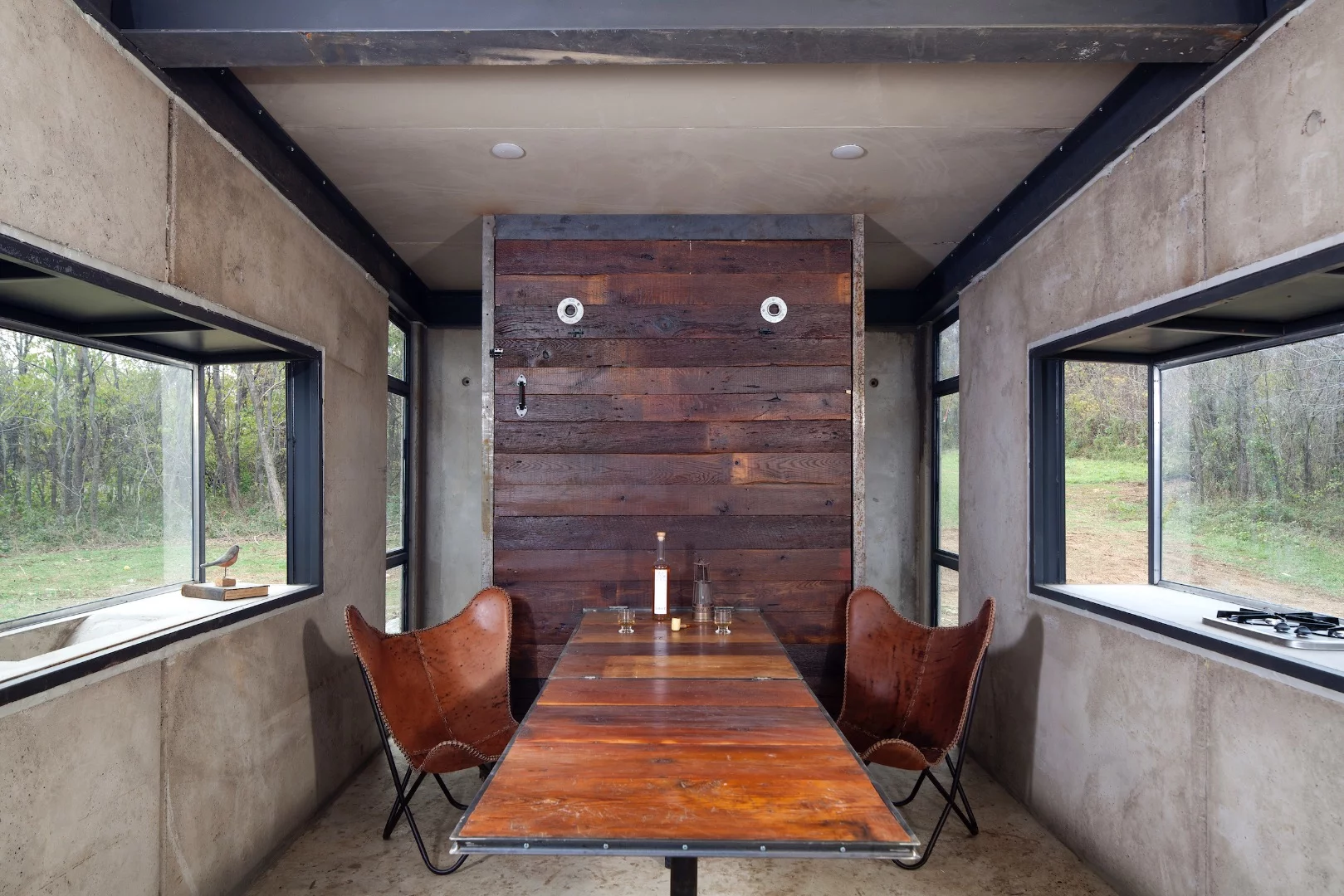 The Lost Whisky Concrete Cabin's murphy-style bed also serves as a dining table