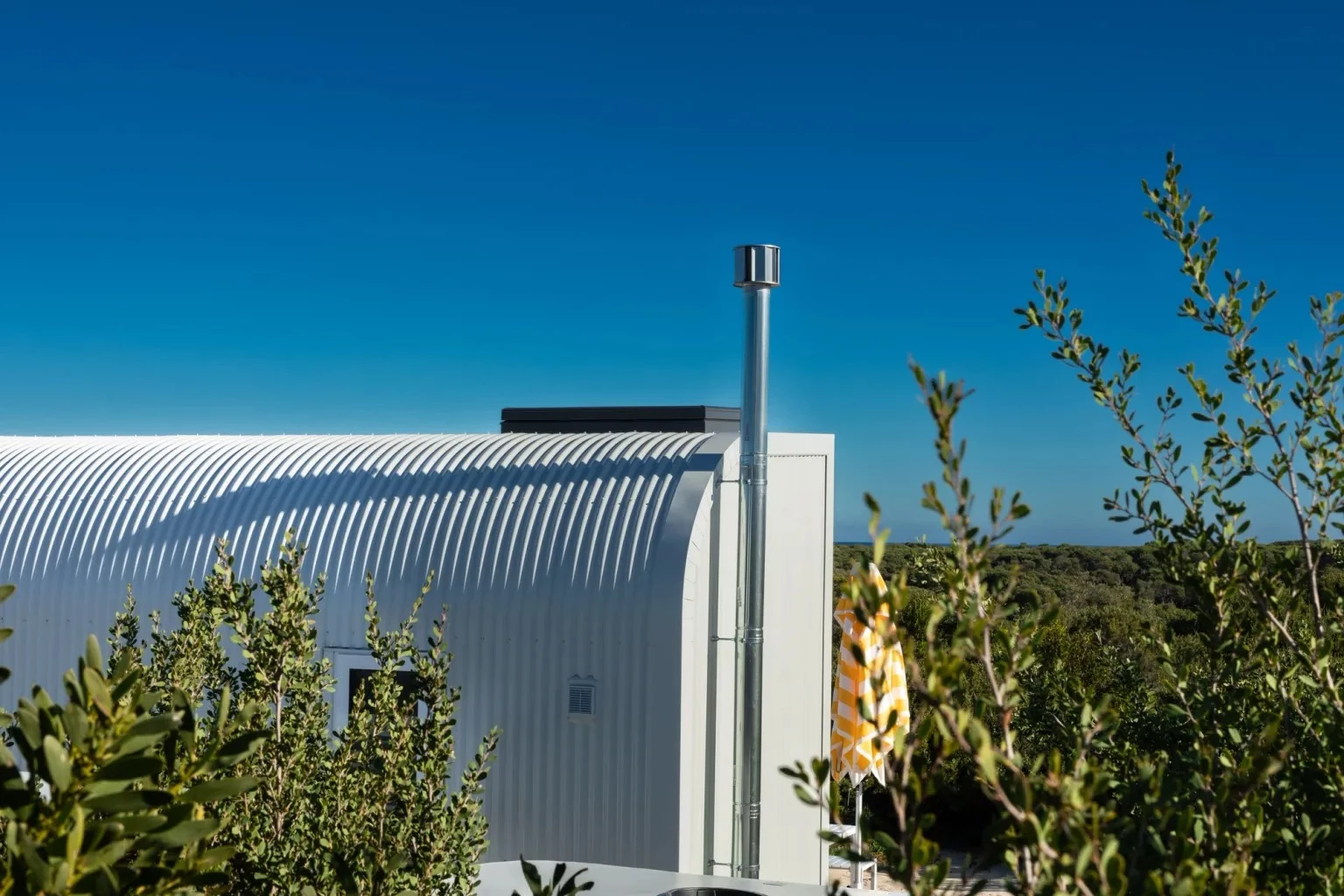 The Fowler & Ward x Base Cabin is finished in utilitarian painted steel, which comes in multiple colors
