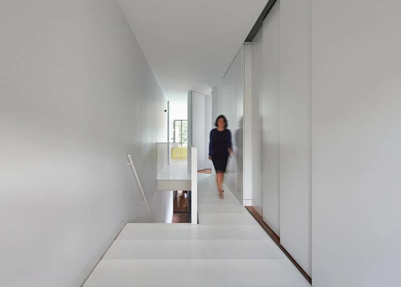 Upstairs, a section of the master bedroom slides to increase available space by opening it up to the corridor