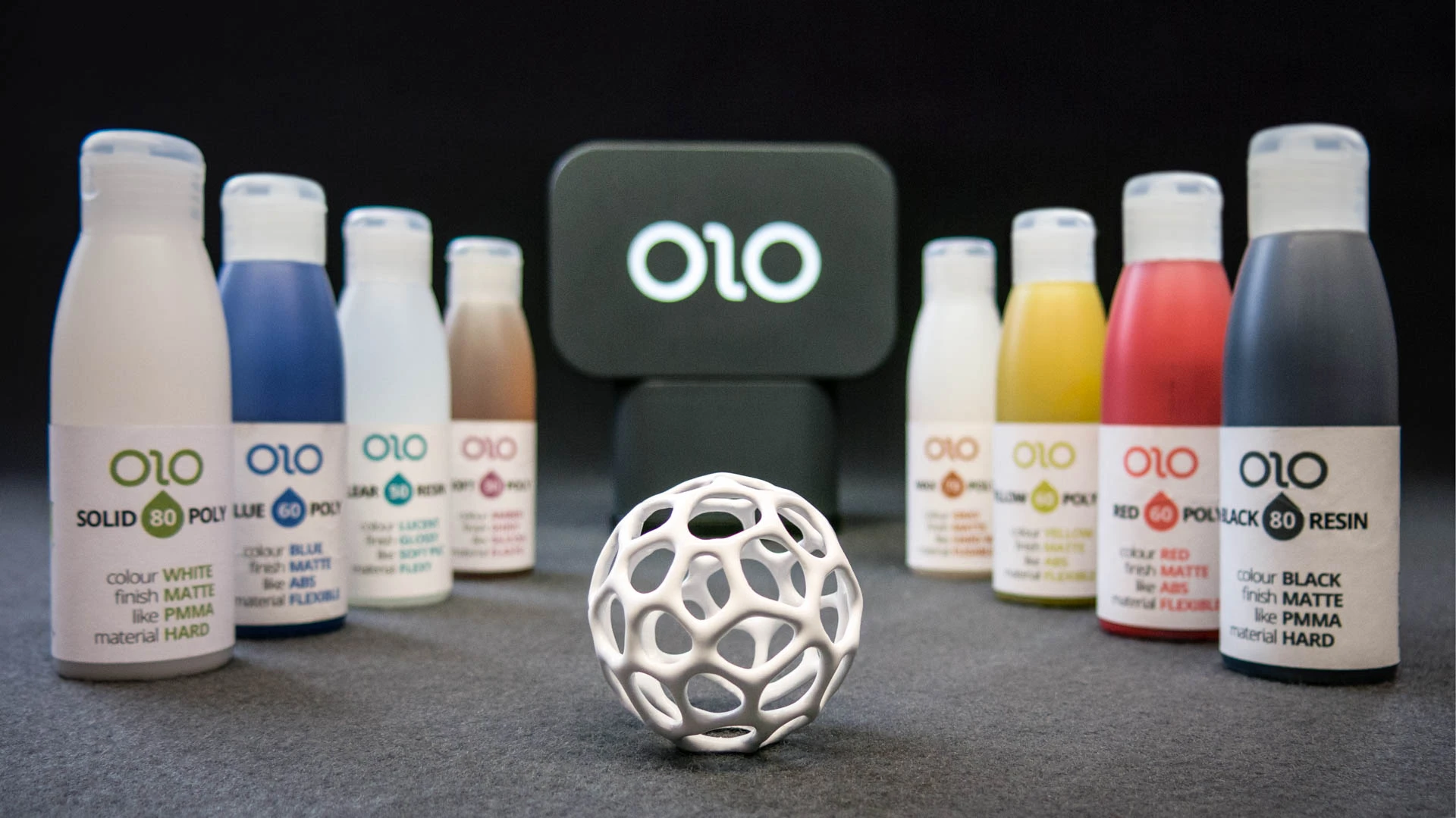 100 g bottles of daylight resin for the OLO 3D printer are available in a variety of colors, finishes, and material types