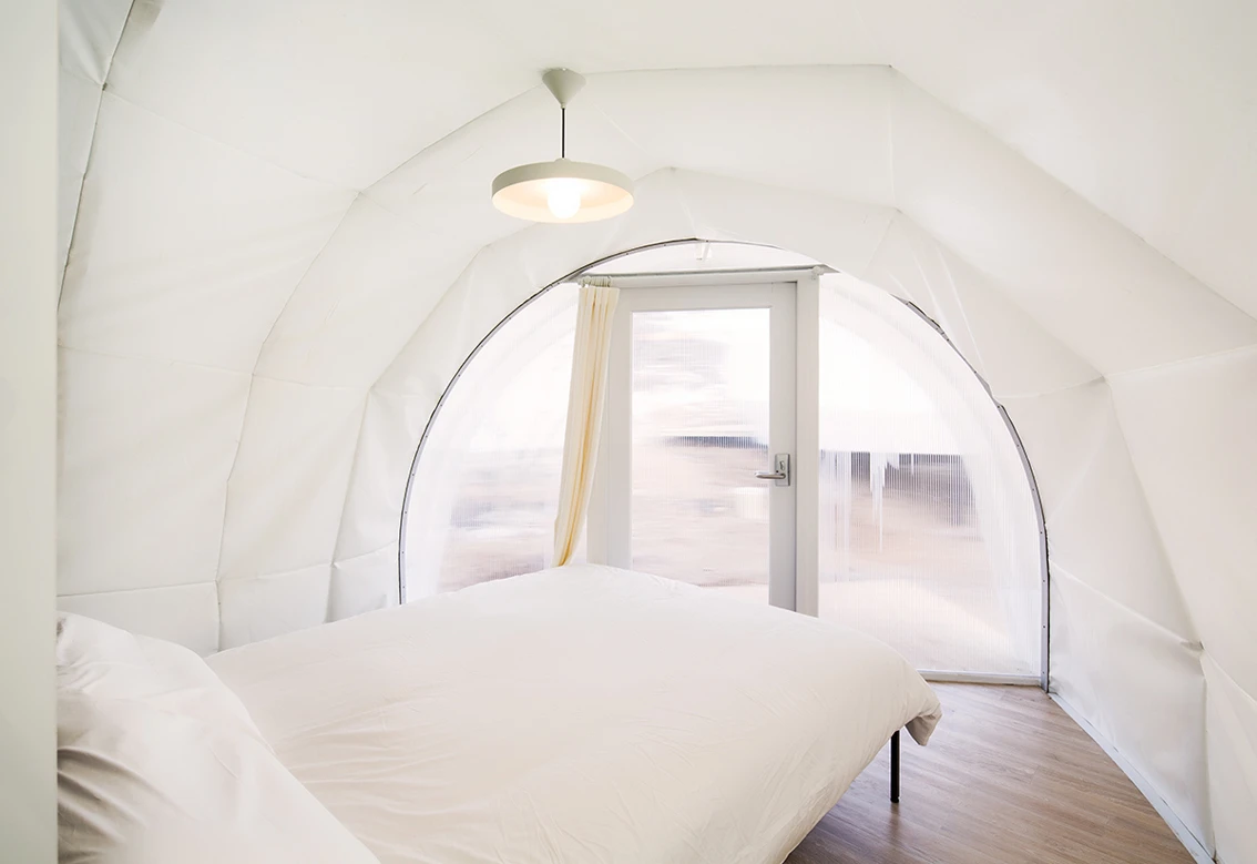 Inside, guests can enjoy polished wooden flooring and comfortable real beds (Photo: June Young Lim)