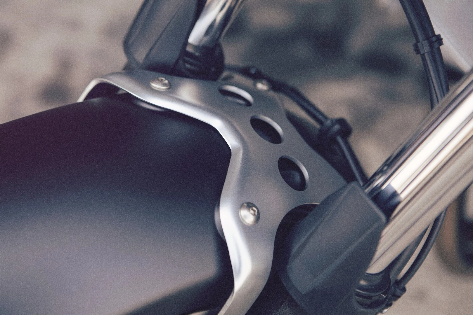 An aluminum brace holds the front fender