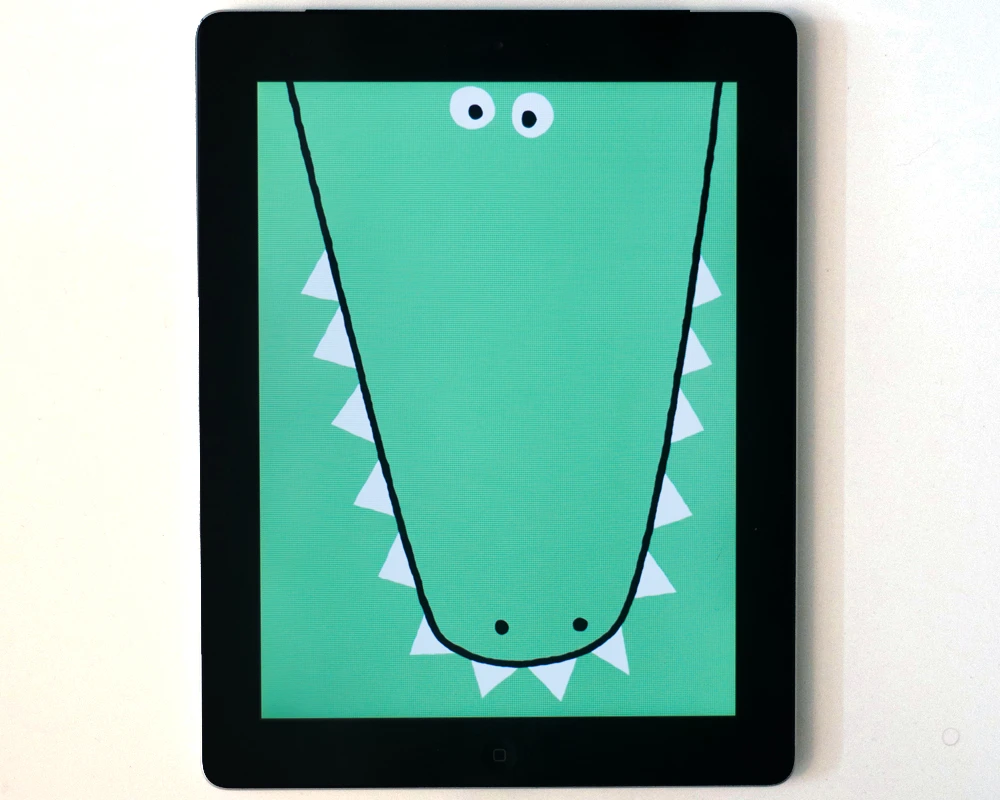 The DRAWNIMAL app gives instructions of shapes to draw around the iPad, which then become parts of the animated animal on screen