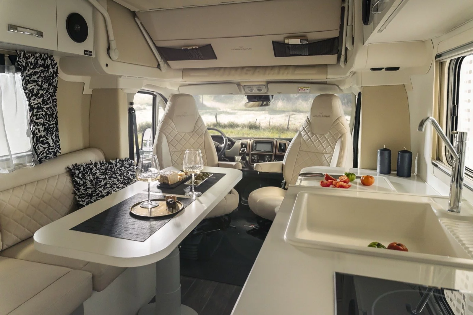 The dining table can slide forward and backward, side to side, rotate, and adjust in height via its telescoping pedestal - it drops down at night to complete the bed