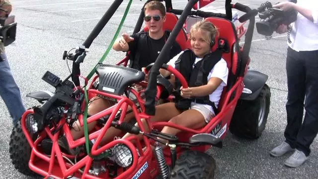 A blind volunteer trying out Virginia Tech's BDC system in a dune buggy
