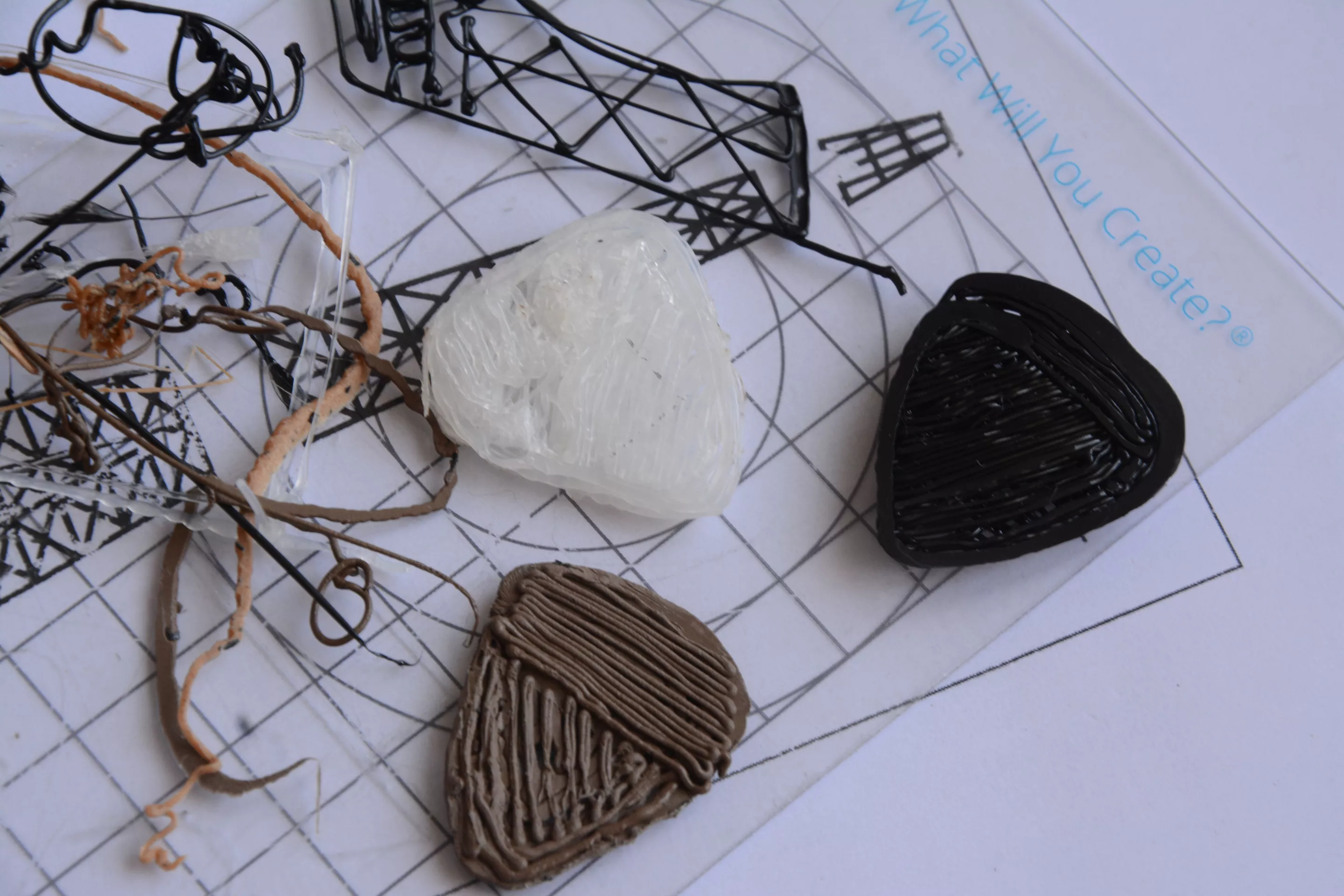 Getting to grips with the Pro+ gave us a few piles of wasted filament, and some (not very practical) guitar picks