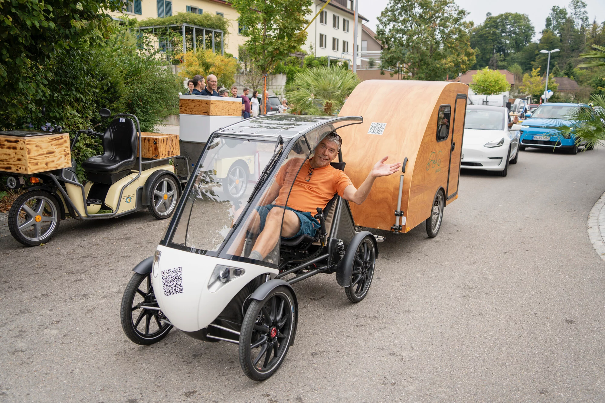 Erich Zeller tows the i:woody behind a Pedilio velomobile