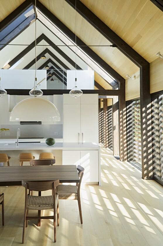 A newly finished dwelling in upstate New York takes careful cues from traditional farm buildings of the area, but makes every effort to afford it inhabitants the comfort of a modern home