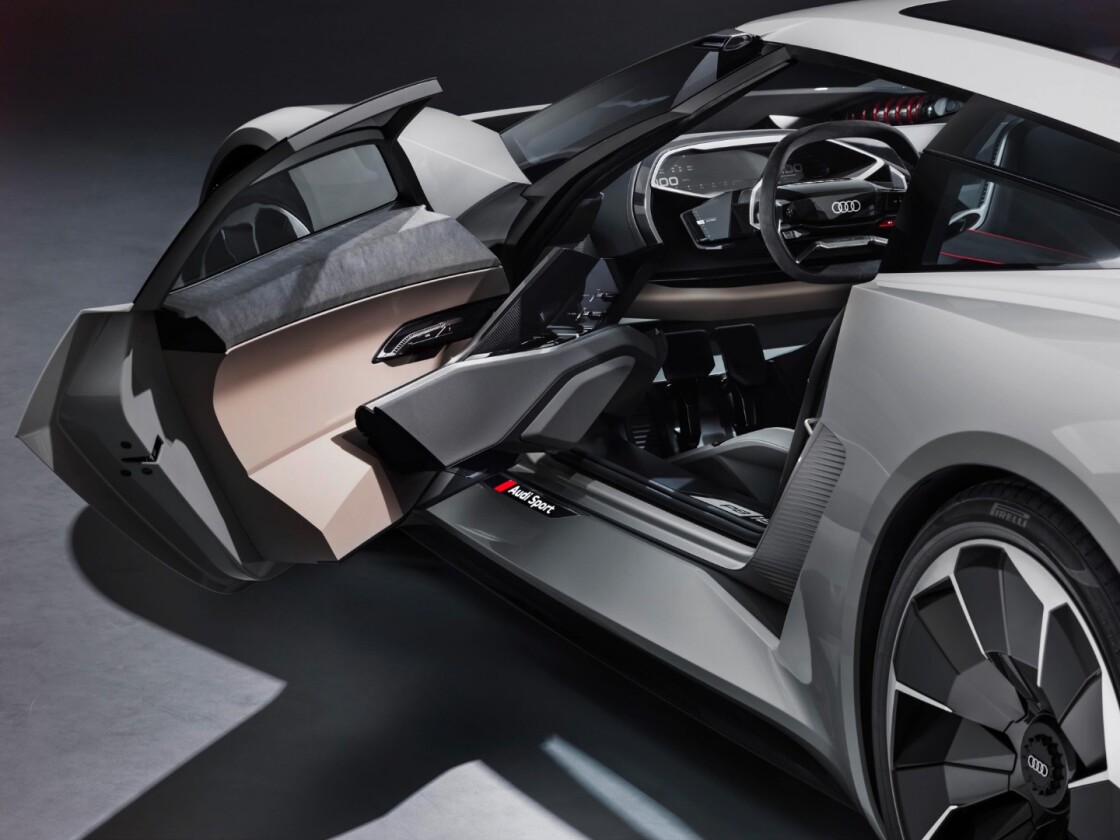 With the door open, the PB 18 e-tron's monocoque can be moved to different positions inside the car and it also reveals the unusual interior tech that's mounted in this Audi
