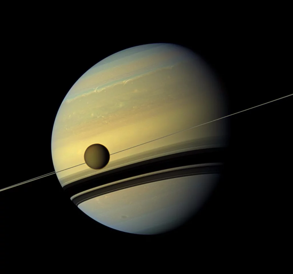 2012 Cassini image displaying Saturn alongside her largest moon, Titan