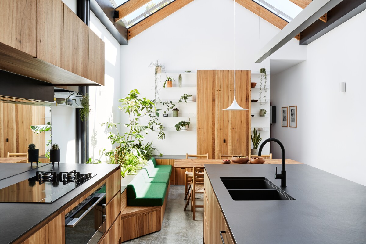 Newry House turns what Austin Maynard Architects describes as "one of the smallest, darkest, bleakest dining rooms to ever exist" into a light-filled center of the family home