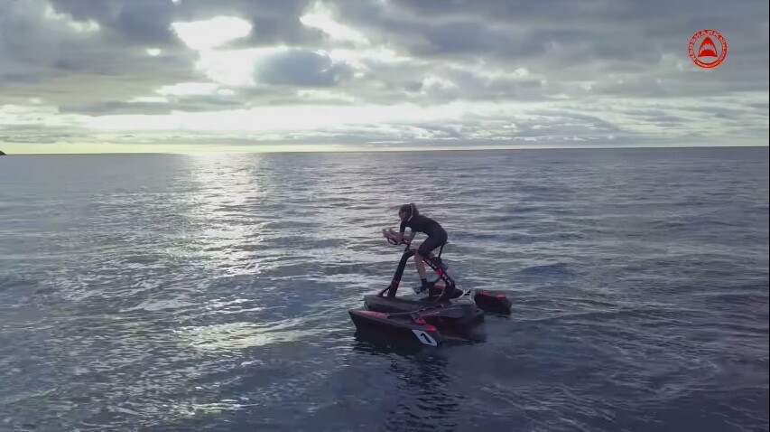 The RedShark trimaran features a retractable rudder, salt water-proof drive shaft, stainless steel nuts and bolts, and a folding design that allows it to be transported on a regular car-mounted bicycle rack