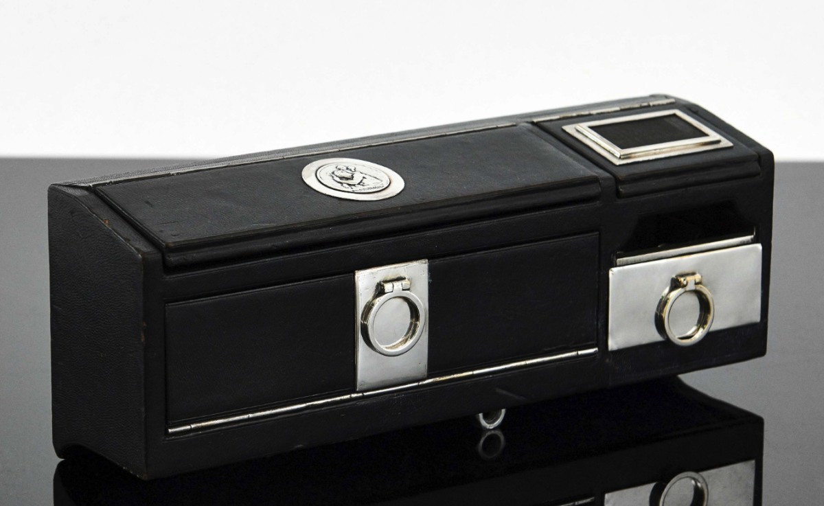 Auction Link: Artcurial | Estimate: €2,000 to €3,000 | A rare black leather motorcar tuxedo Travel Smoker Kit for Cars by Hermes Paris, c. 1930