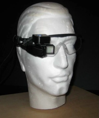 While wearing the glasses, a pilot can see a 3D virtual overlay of the runway and airport in one eye
