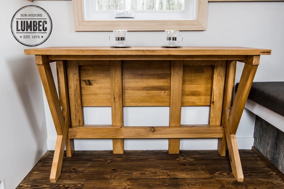 The dining table folds in half