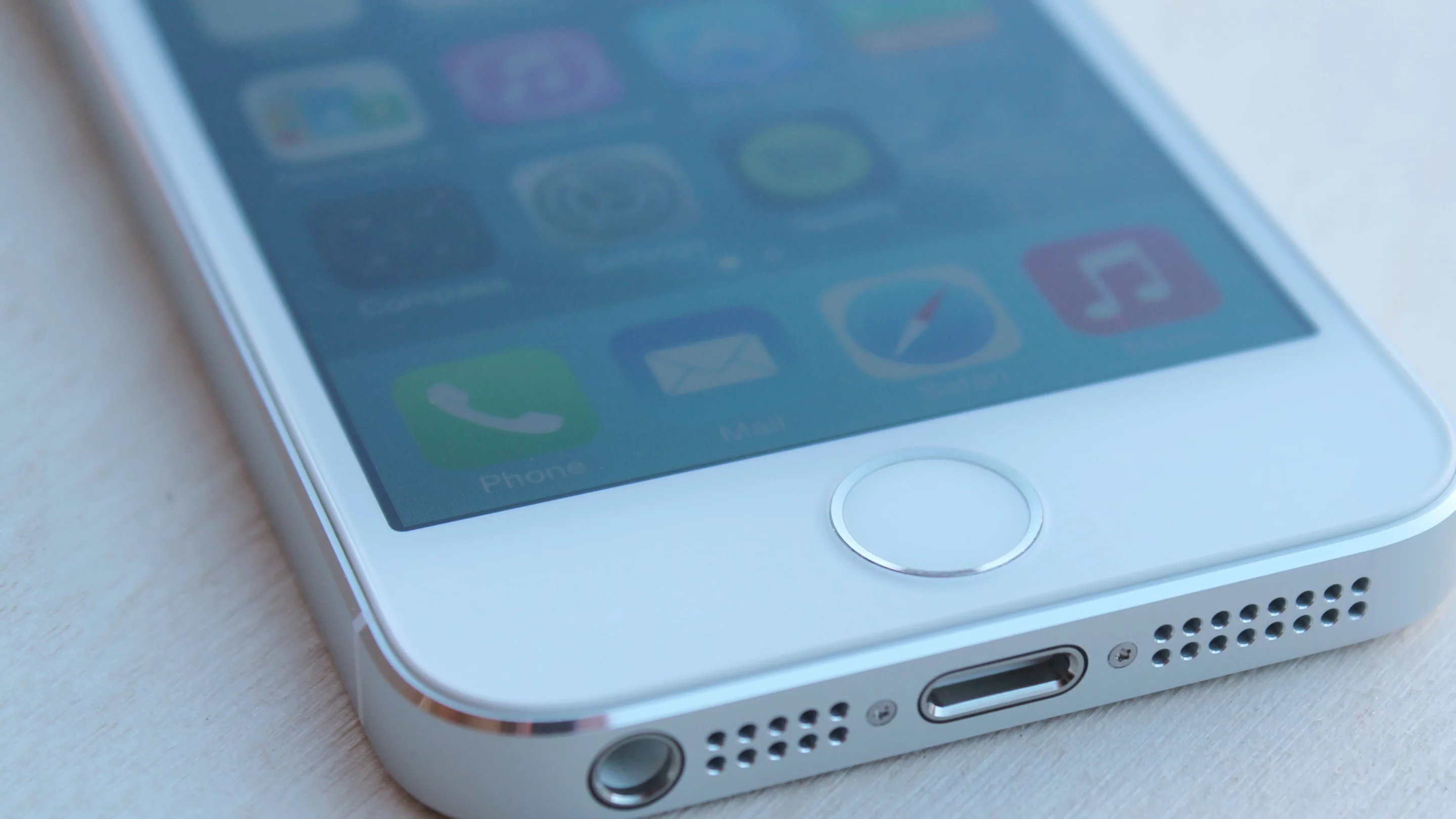 Under the 5s' home button lives Apple's Touch ID fingerprint sensor