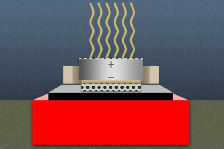 Researchers have developed a coating that prevents a battery from conducting electricity when swallowed (Image: Christine Daniloff/MIT)