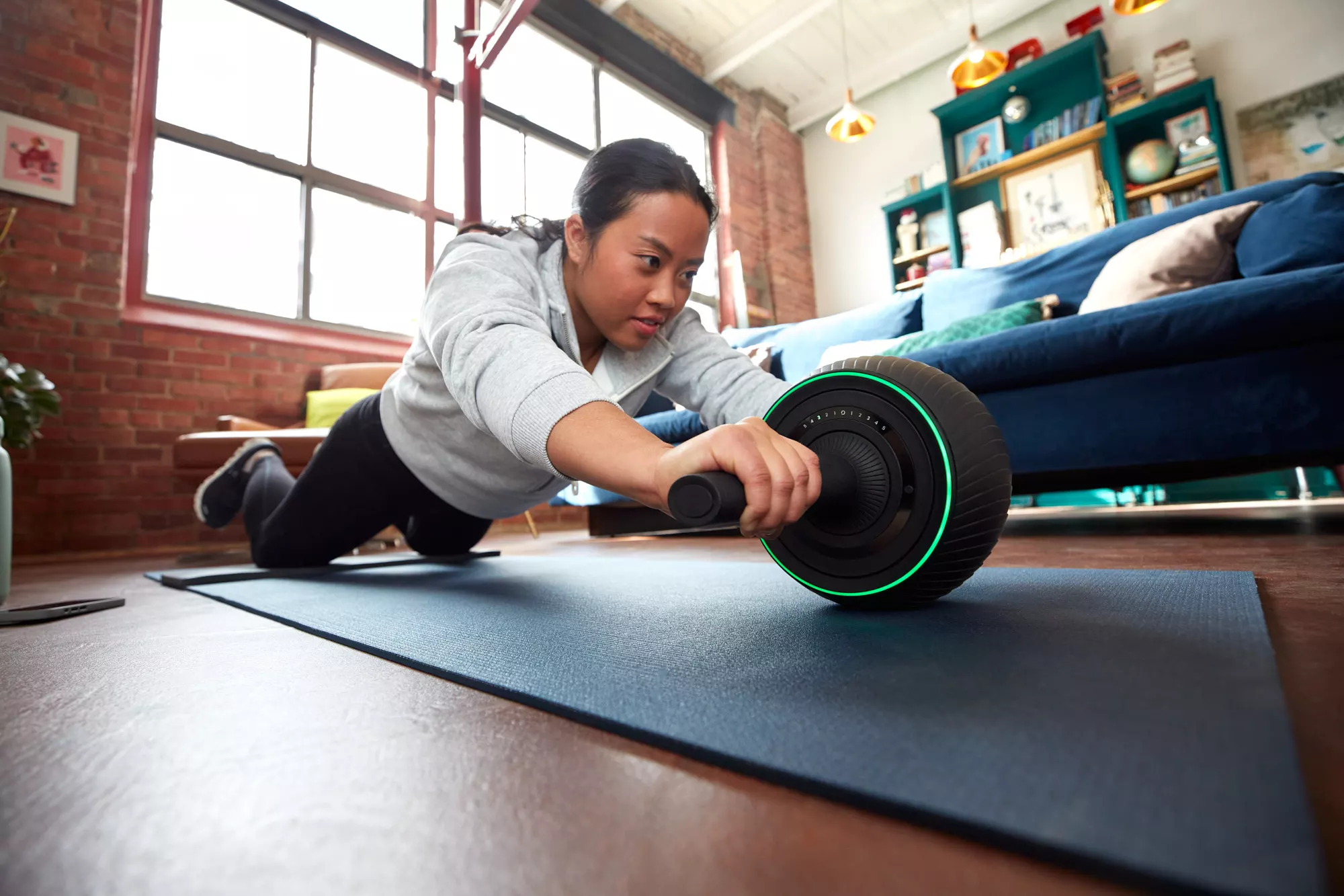 The ZeroWheel uses a motor to provide either resistance or assistance while performing core-strengthening exercises