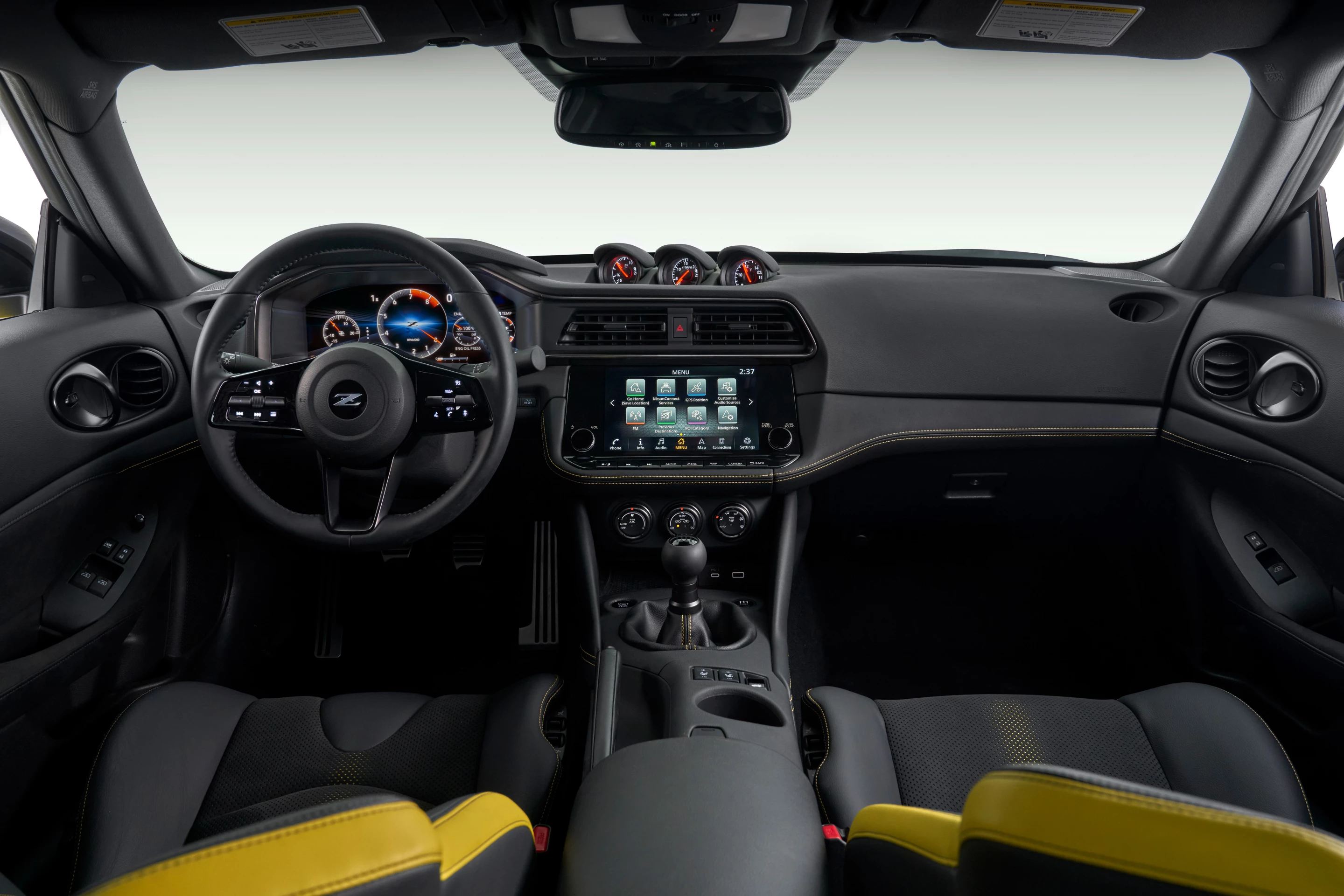 In the Nissan Z Performance, the larger infotainment, added gauges, and other details are clear