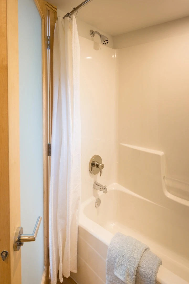 The bathroom boasts a shower and bath