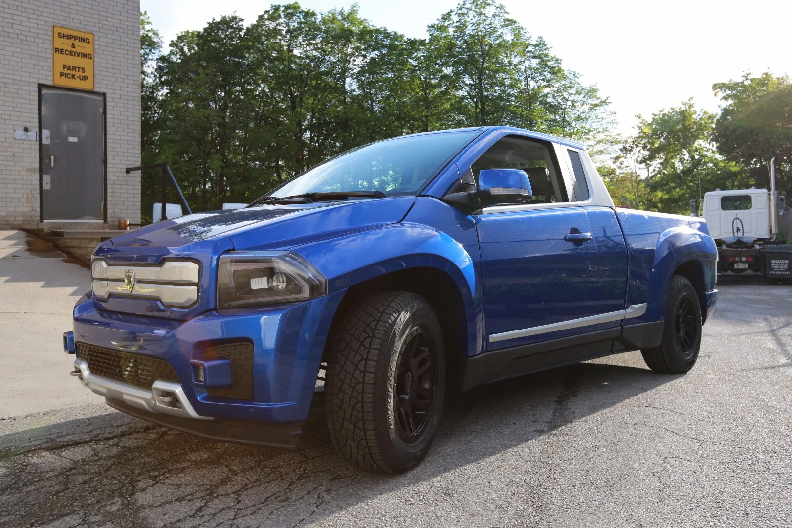 According to the Bison designer, the e-truck speaks a bold design language, punctuated with angular cladding and wedge profiles