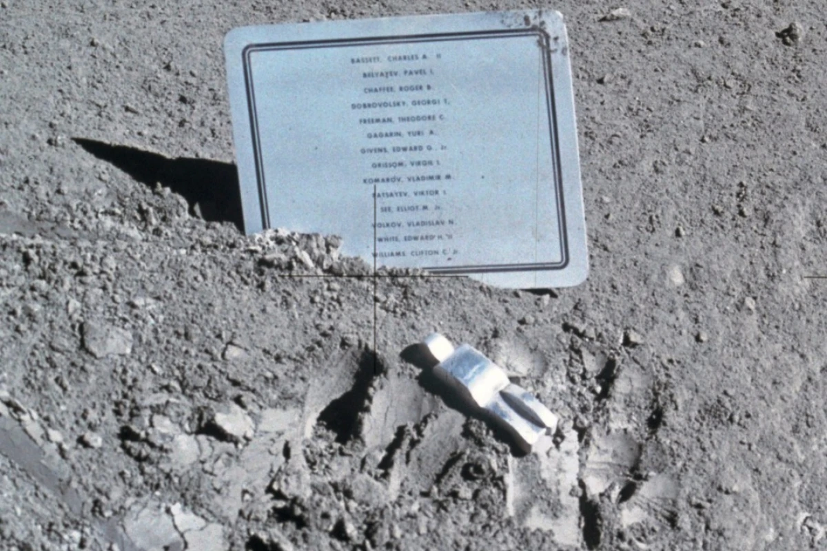Photo of the Fallen Astronaut and accompanying name plaque left on the moon during the Apollo 15 mission