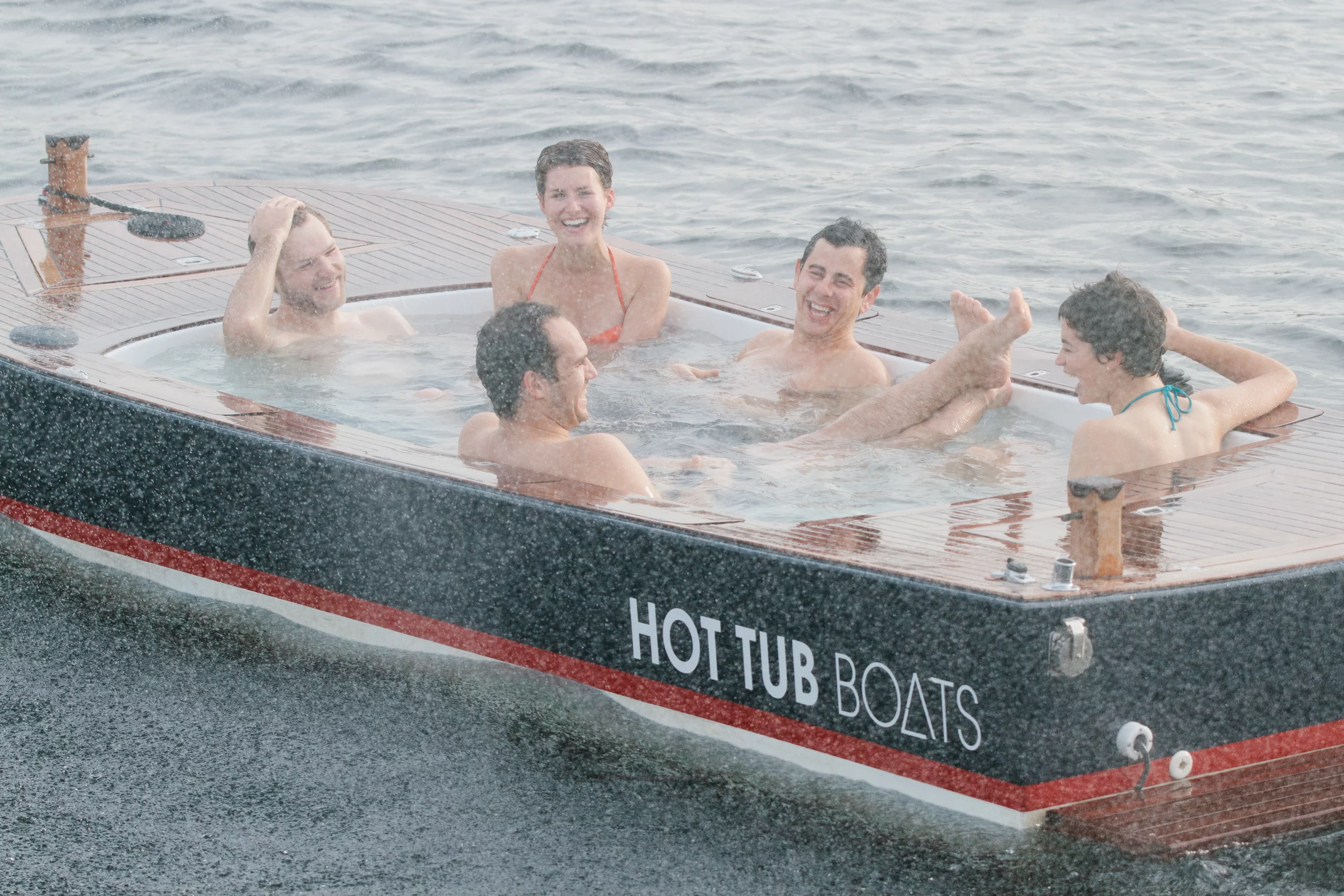 The Hot Tub Boat allows its passengers to soak while they cruise