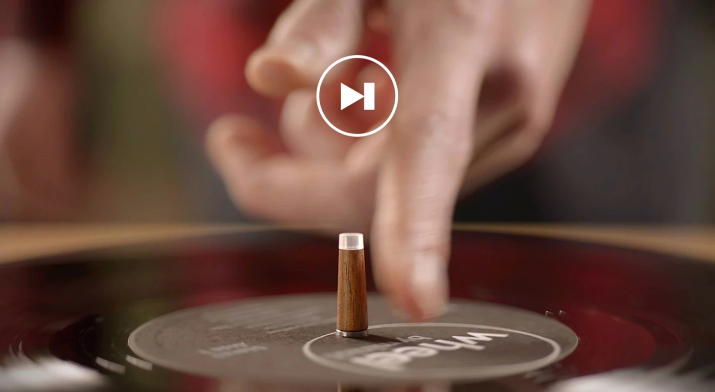 The Wheel's spindle, or center stick, is used to control operation and playback