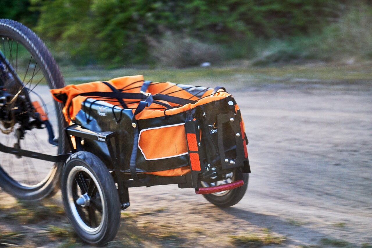 The Trenux can be attached to the bike's frame, or to a variety of rear-wheel axles