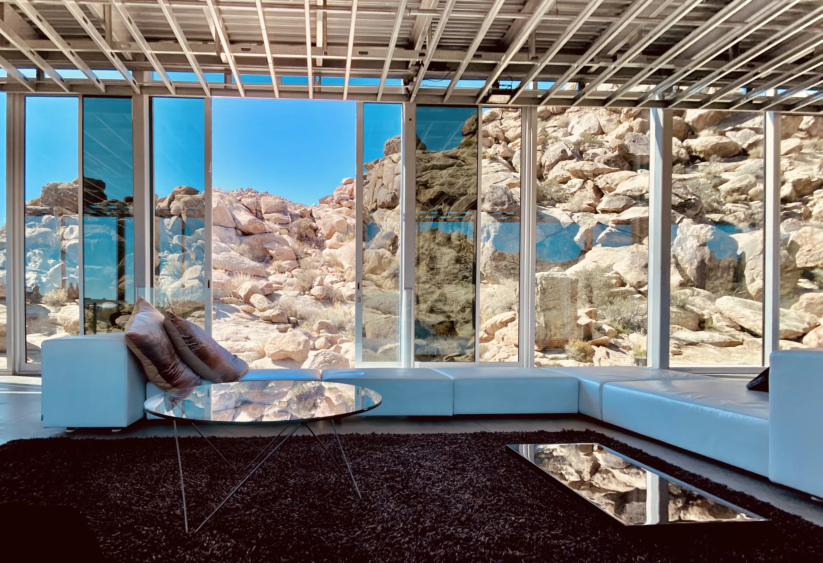 The Invisible House's glazed walls slide open at several points