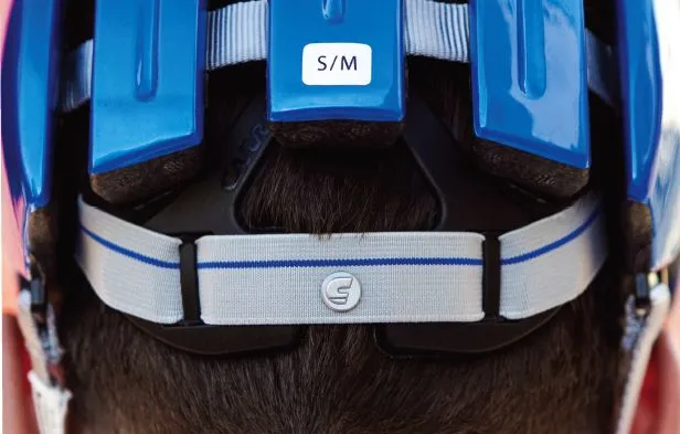 The helmet features an elastic sizing system