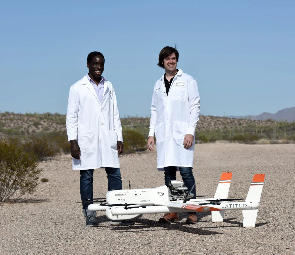 Dr. Timothy Amukele and Jeff Street, with the drone
